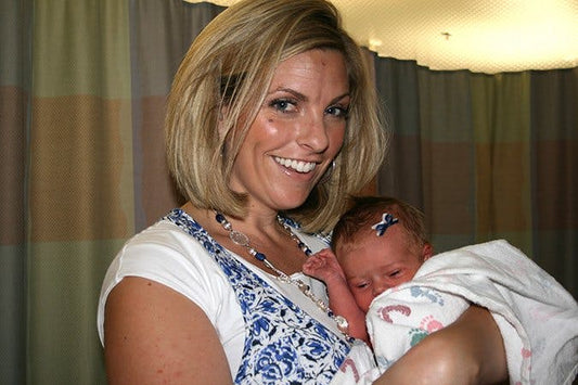 Brandi holding newborn baby